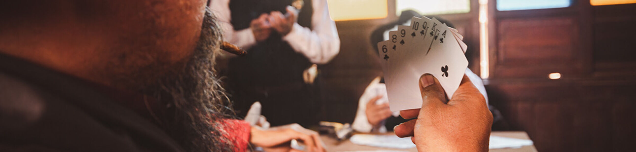 cowboys-group-playing-poker-an