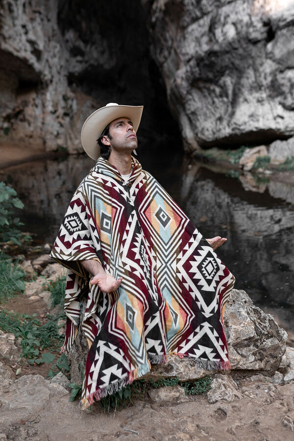 a-mexican-man-wearing-a-poncho