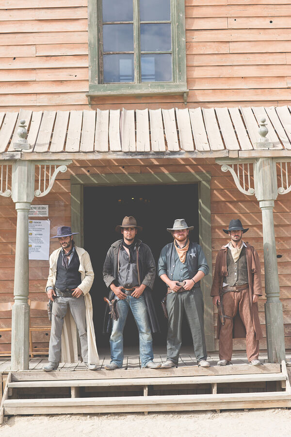 portrait-of-four-cowboys-stand