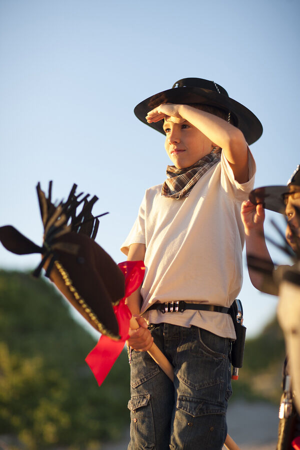 two-boys-dressed-as-cowboys-on