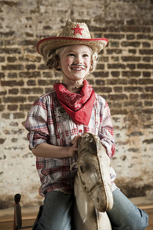young-cowboy-joyfully-riding-a